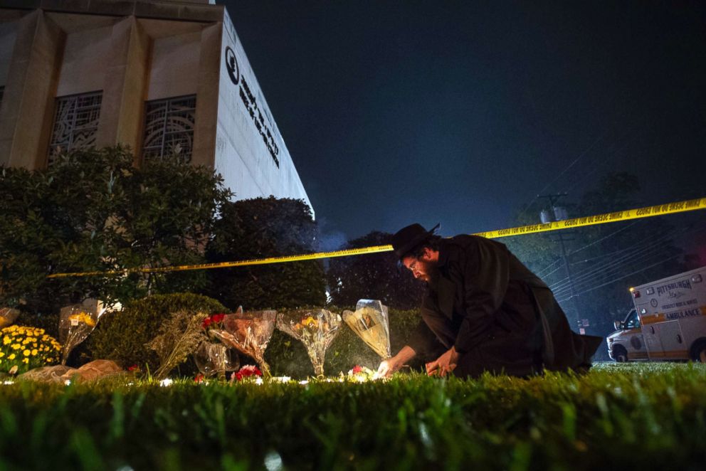 PHOTO: Rabbi Eli Wilansky lights a candle after a mass shooting at Tree of Life  Synagogue in Pittsburgh, Oct. 27, 2018. 