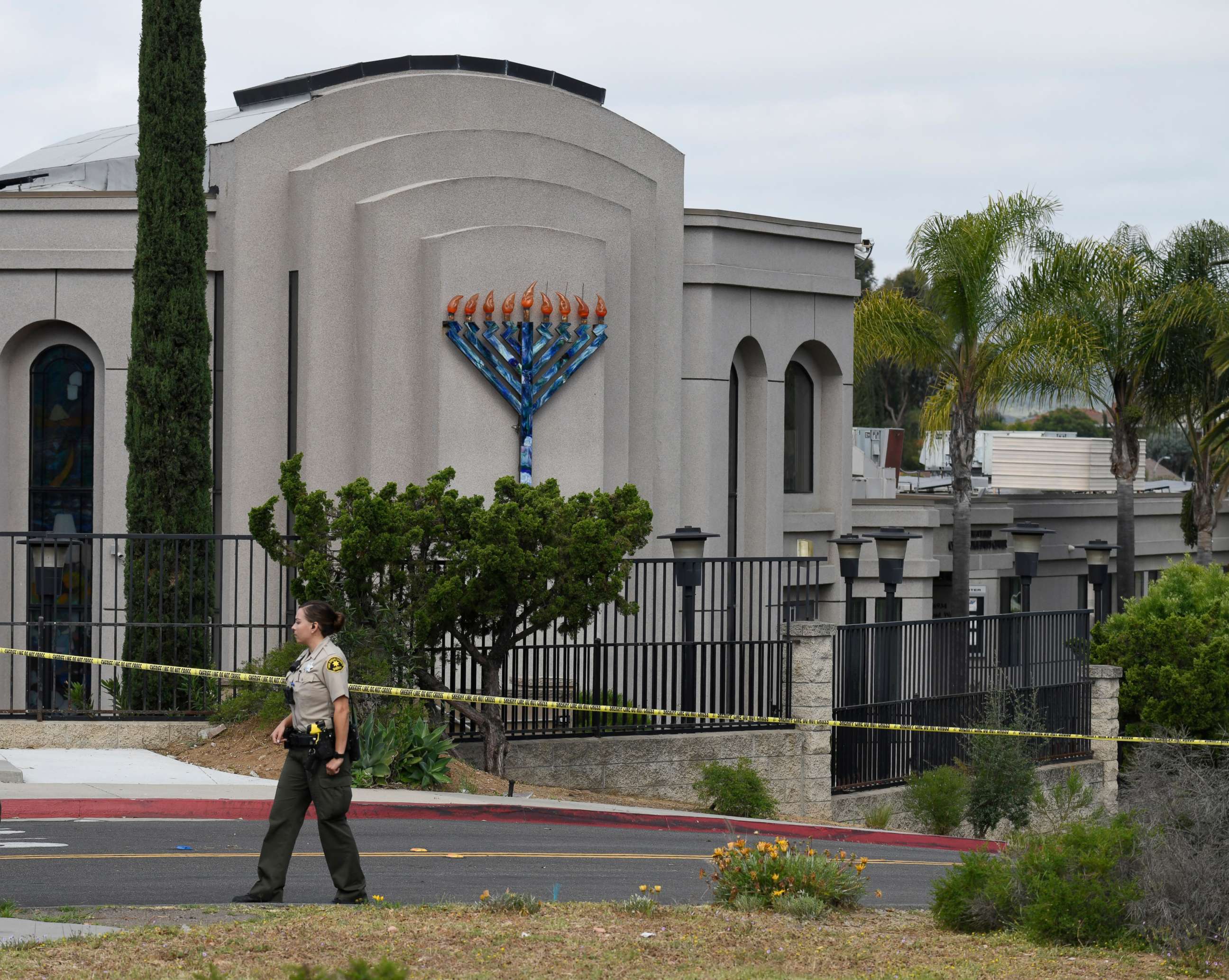 PHOTO: A San Diego county sheriff's deputy stands in front of the Chabad of Poway synagogue, Sunday, April 28, 2019, in Poway, Calif.