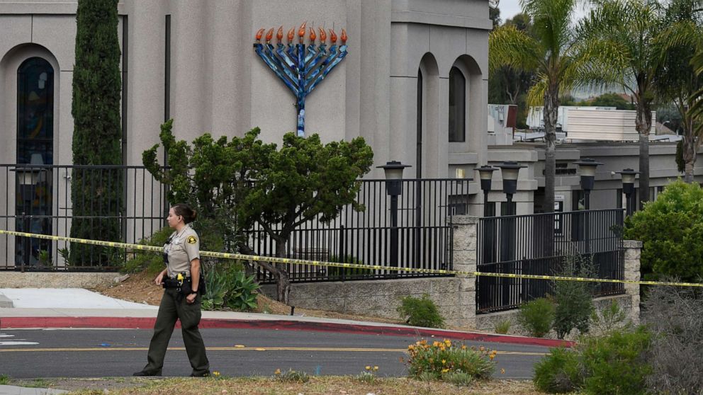 PHOTO: A San Diego county sheriff's deputy stands in front of the Chabad of Poway synagogue, Sunday, April 28, 2019, in Poway, Calif.