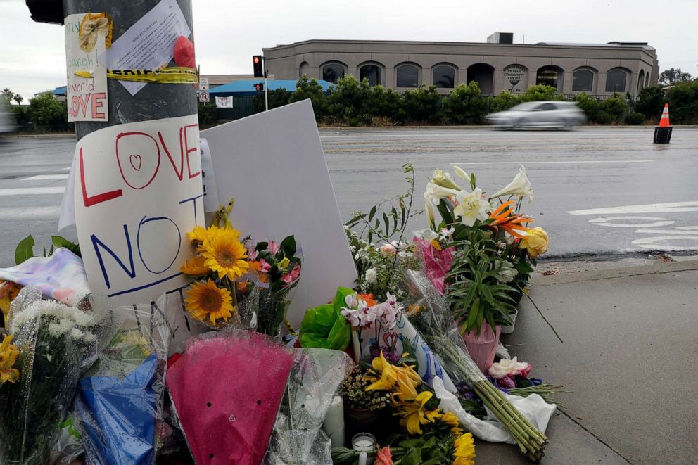 PHOTO: In this April 29, 2019 file photo signs of support and flowers adorn a post in front of the Chabad of Poway synagogue, in Poway, Calif.