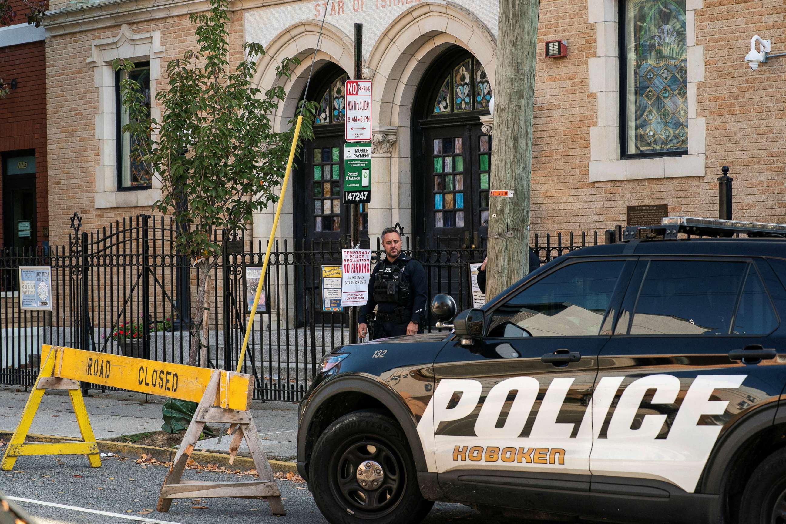 PHOTO: New Jersey police officers stand guard in front of the United Synagogue of Hoboken in New Jersey, U.S., November 4, 2022. 
