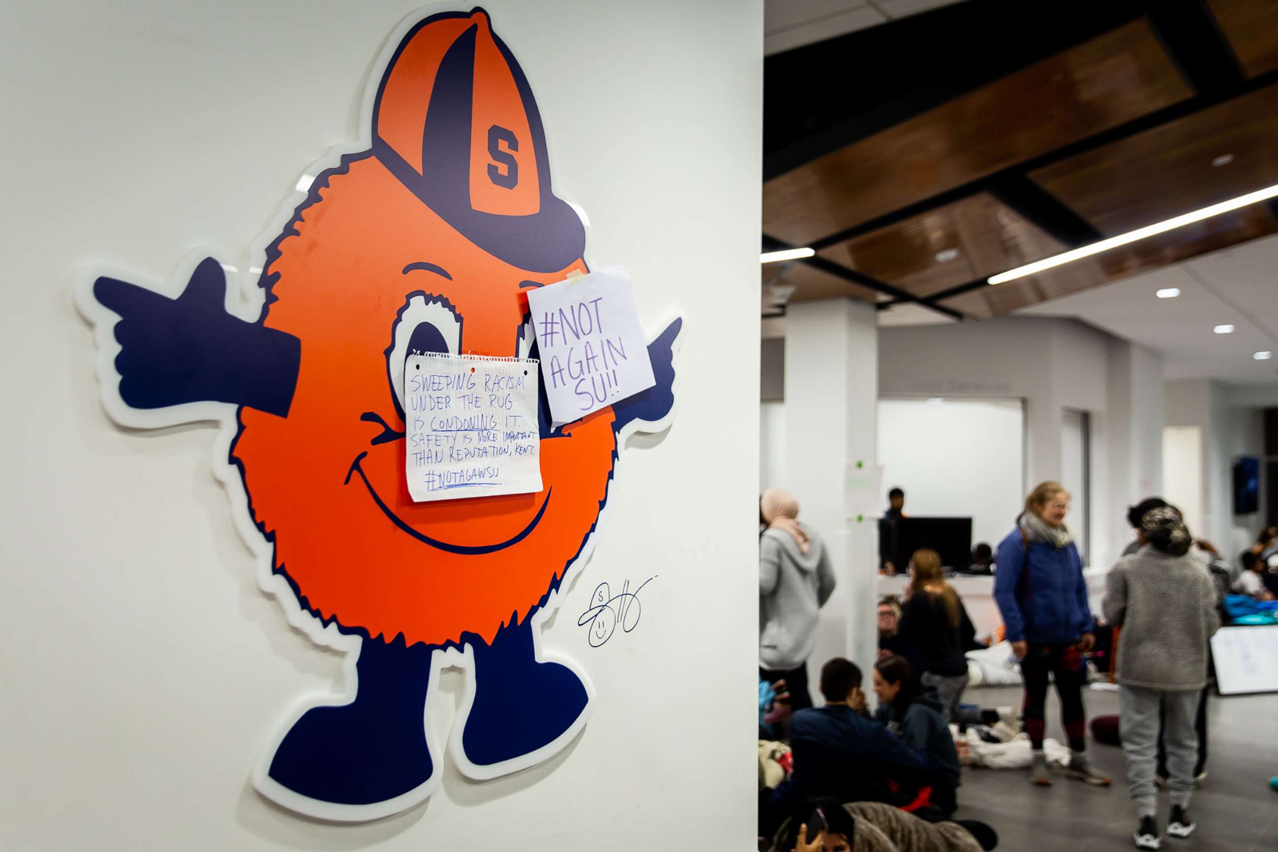 PHOTO: Signs hang on the wall marked with the Twitter hashtag #NotAgainSU as the response by Syracuse University administration to the racist incidents in Syracuse, N.Y., Nov. 19, 2019. 