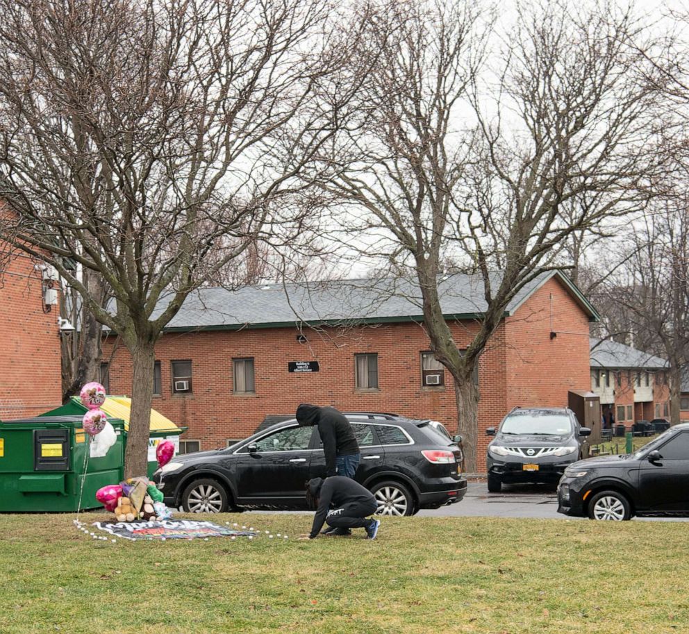 PHOTO: Mourners gather at a makeshift memorial near the intersection of Martin Luther King East and Oakwood Avenue, where 11-year-old Brexialee Torres was killed in a drive-by shooting the night before, in Syracuse, N.Y., Jan. 17, 2023.