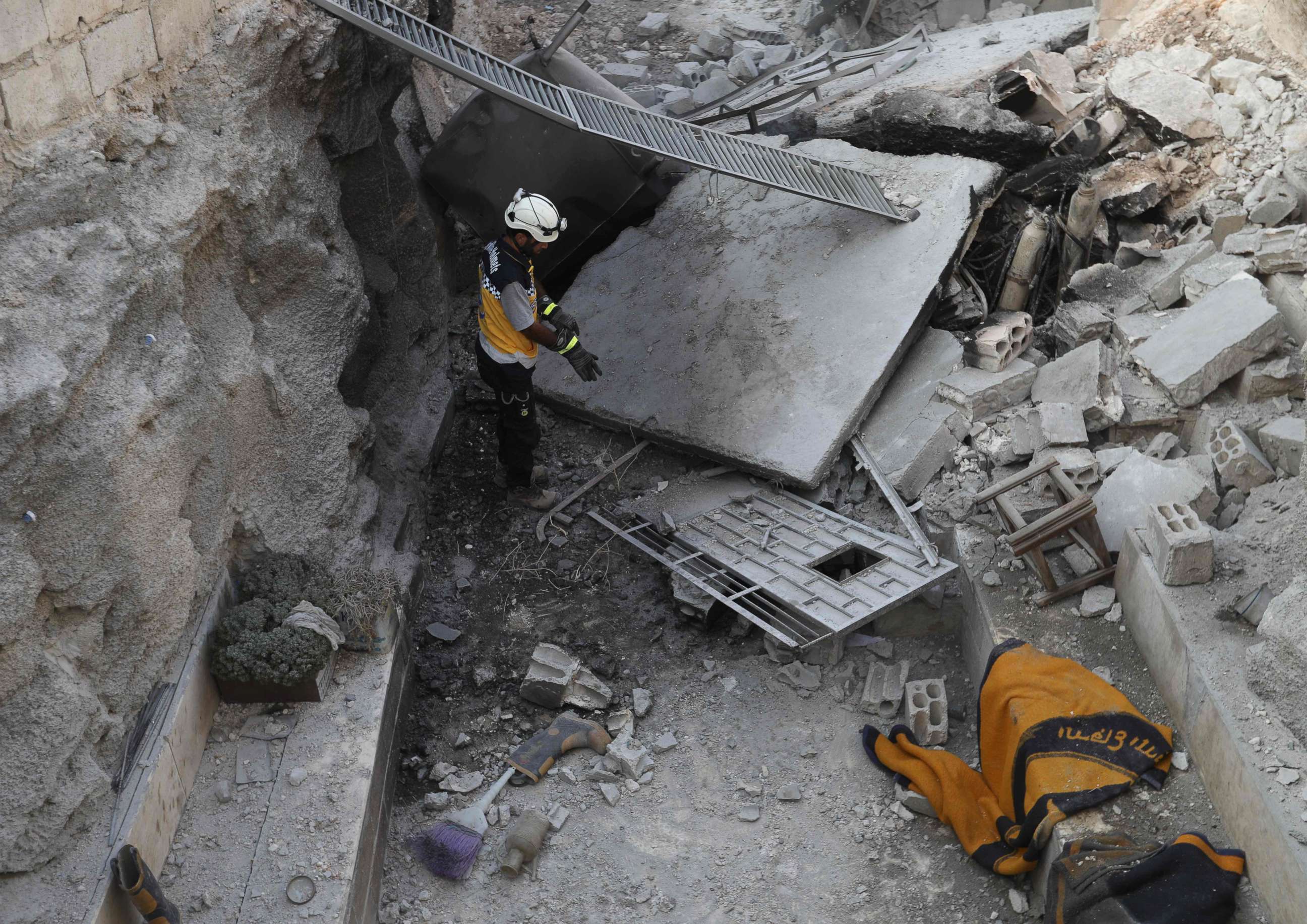 PHOTO: A member of the Syrian Civil Defence walks through the wreckage of their center which was destroyed by government forces' bombardment in the town of al-Tamana on the southern edges of the rebel-held Idlib province, Sept. 6, 2018.