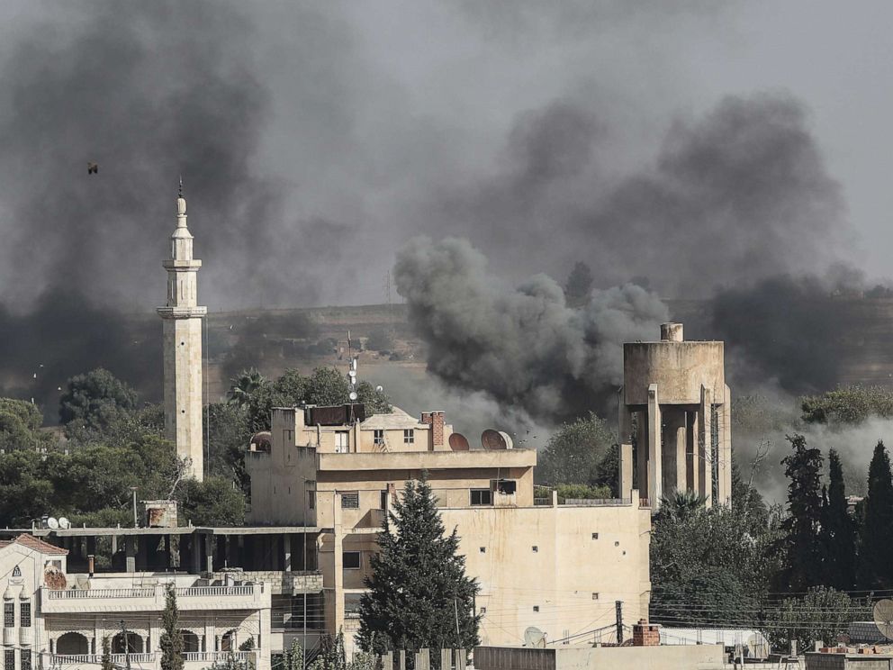 PHOTO: Smoke rises over the Syrian town of Ras al-Ain, as seen from the Turkish border town on October 09, 2019, in Ceylanpinar, Turkey.