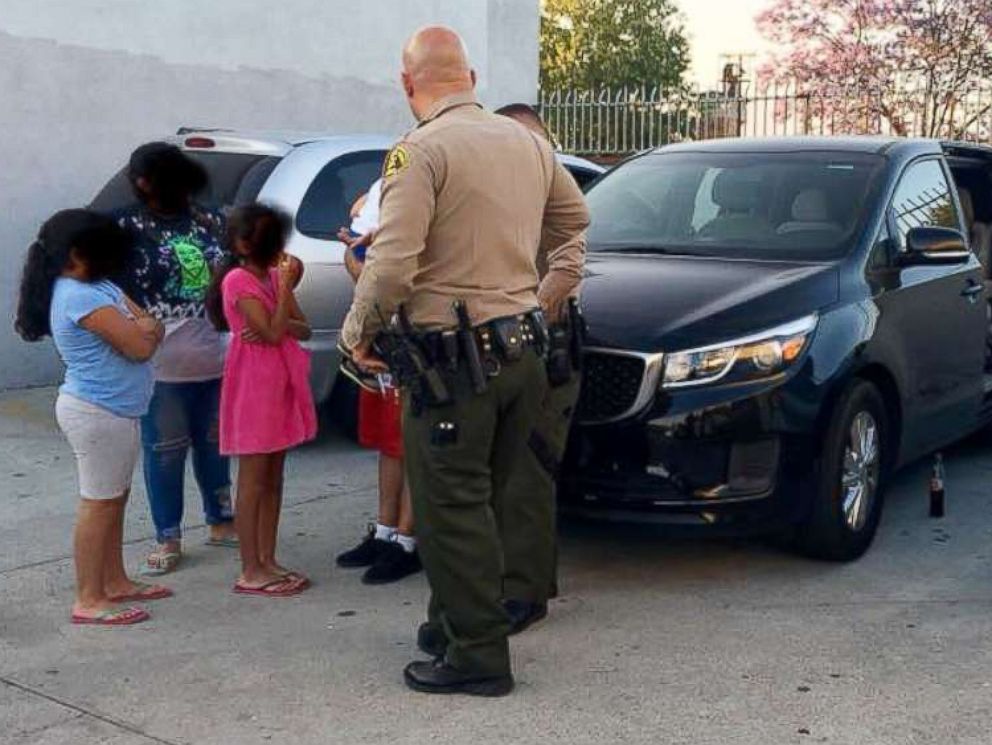 PHOTO: A family of six that was accosted by an armed man while eating a meal in a vehicle parked in City of Industry, Calif., June 10, 2018 is pictured speaking to law enforcement.
