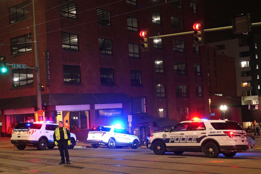 PHOTO: Tacoma Police and other law enforcement vehicles are shown near the site of a car crash, Jan. 23, 2021, in downtown Tacoma, Wash.