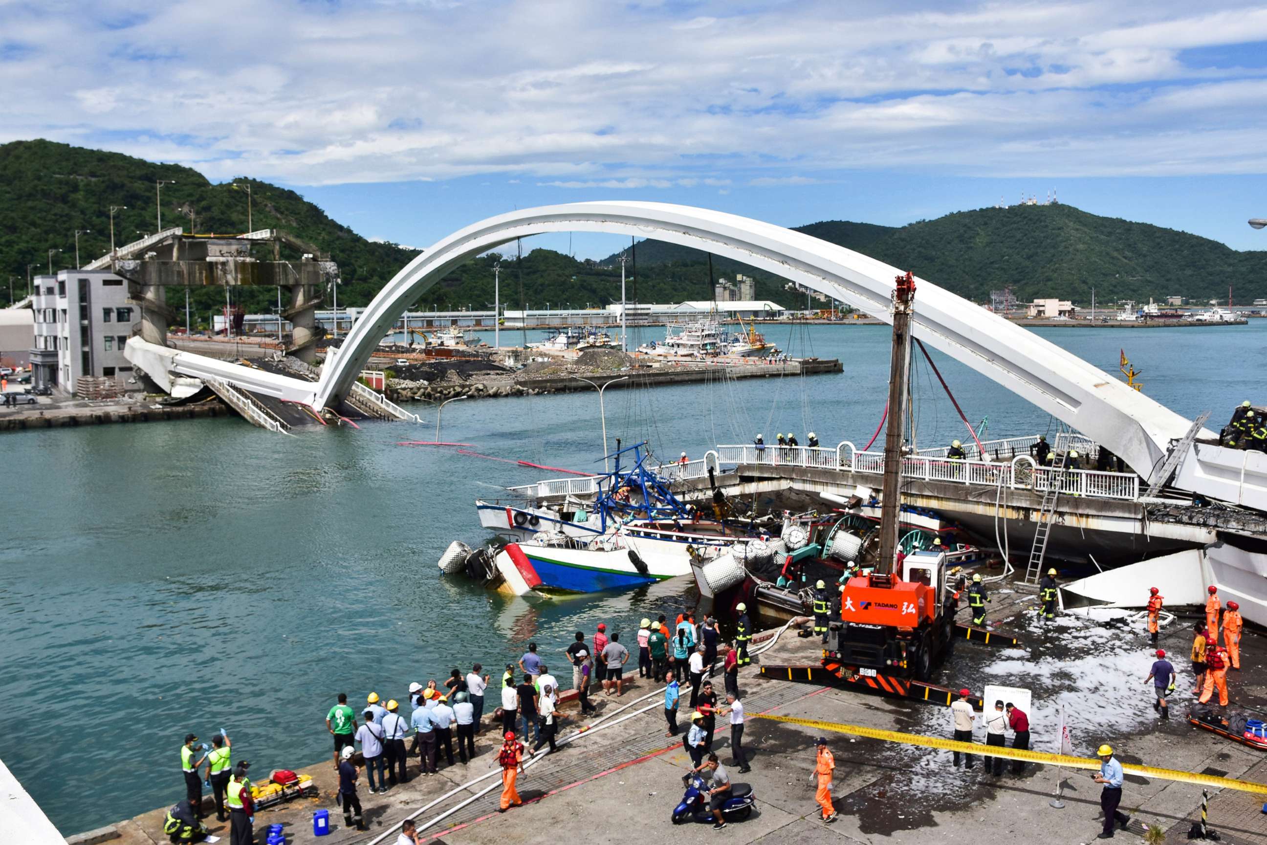 PHOTO: Rescuers work near the site of a collapsed bridge in Nanfangao, eastern Taiwan. Tuesday, Oct. 1, 2019.