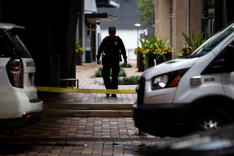 PHOTO: FILE - A law enforcement officer walks outside of 1201 San Jacinto in Houston, following a shooting on Nov. 1, 2022.