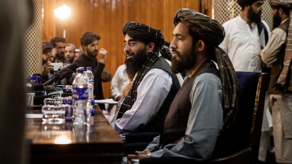 PHOTO: Zabihullah Mujahid, center, the Taliban's spokesperson, speaks to the media in Kabul, Afghanistan on Aug. 17, 2021, at their first news conference after they took control of Kabul.