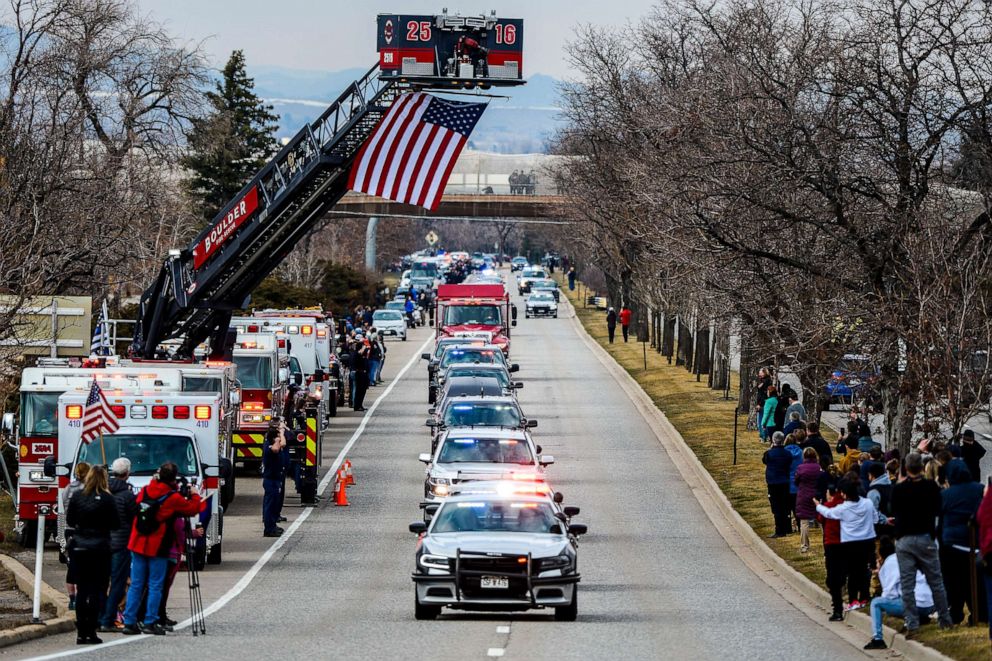 PHOTO: Law enforcement vehicles escort the body of slain Boulder Police officer Eric Talley to a funeral home, March 24, 2021, in Boulder, Colo.