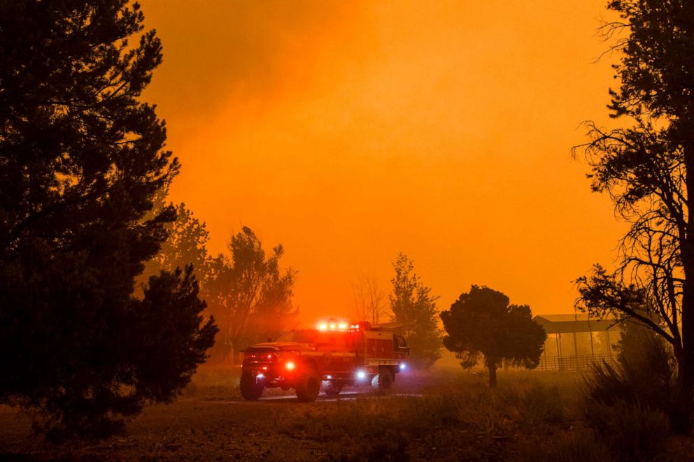 PHOTO: FFire crews work to contain the Tamarack fire as it encroaches on homes in Markleeville, Calif., July 24, 2021.  