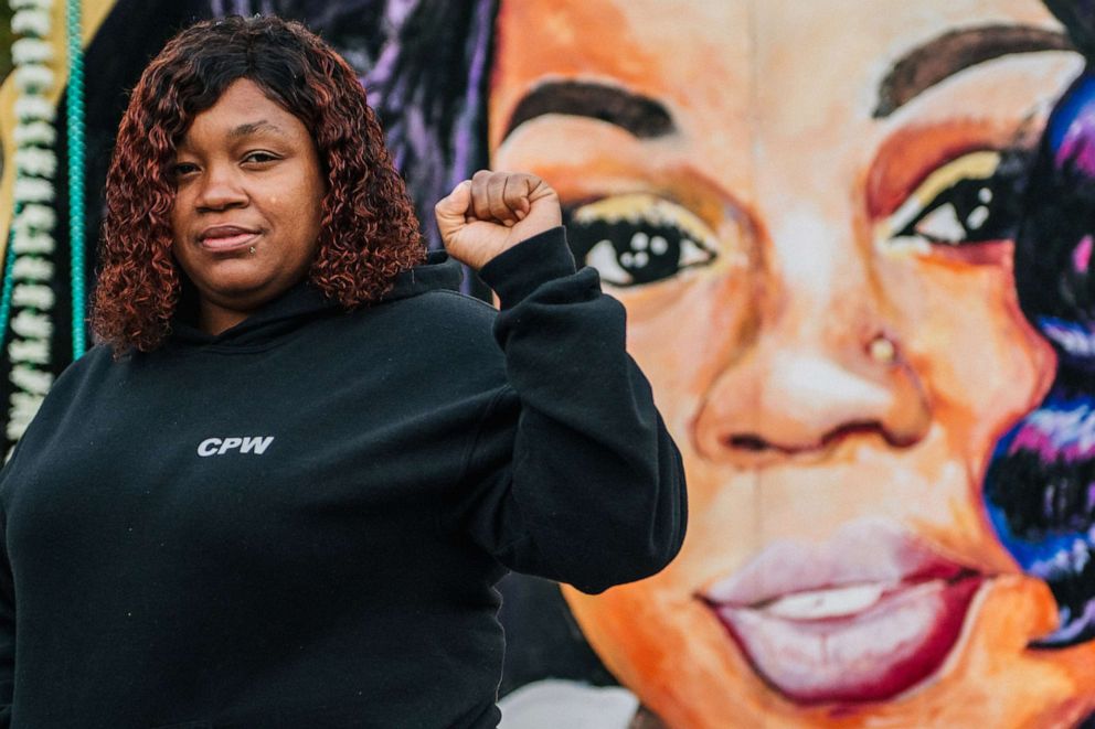 PHOTO: Tamika Palmer, mother of Breonna Taylor, poses for a portrait in front of a mural of her daughter at Jefferson Square park on Sept. 21, 2020 in Louisville, Ky.