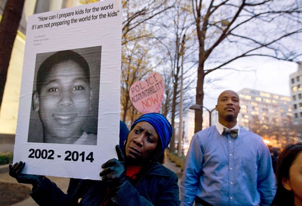 PHOTO: Tomiko Shine holds up a picture of Tamir Rice during a protest in Washington, D.C., Dec. 1, 2014 . Rice, a 12-year-old with a pellet gun was fatally shot by a Cleveland police officer.