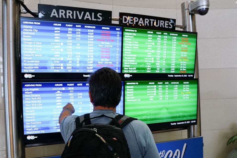 PHOTO: The arrival and departures board lists numerous flight cancelations at Tampa International Airport before the airport's planned closure ahead of Hurricane Ian, Sept. 27, 2022 in Tampa, Fla.