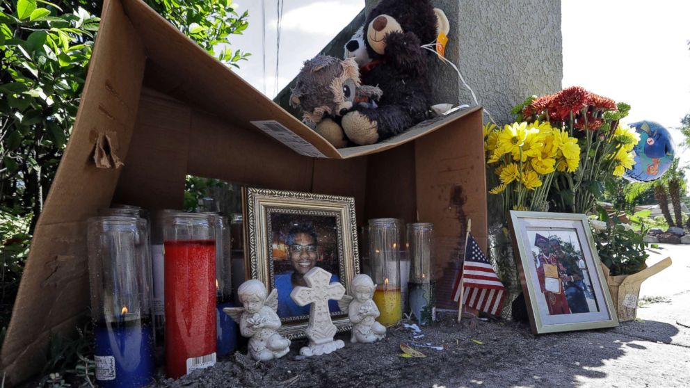 A makeshift memorial for shooting victim Anthony Naiboa sits on a sidewalk in the Seminole Heights section of Tampa, Fla., Oct. 24, 2017. Similar murders have occurred in the neighborhood in the span of two weeks leading fears of a possible serial killer.