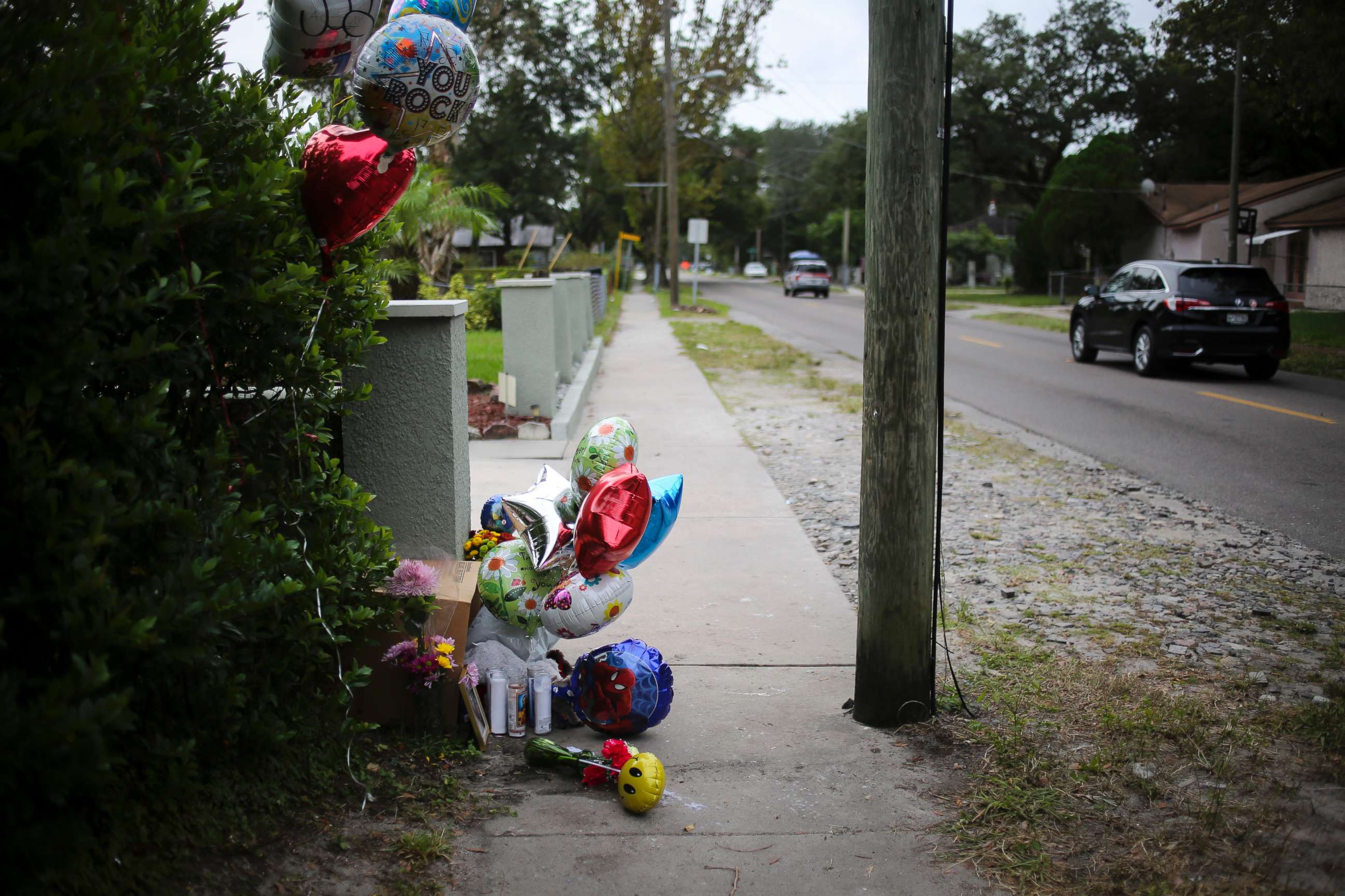 PHOTO: Balloons and candles seen along 15th Street on Oct. 23, 2017 where Anthony Naiboa, 20, was found dead on Oct. 19 in Southeast Seminole Heights in Tampa, Fla.