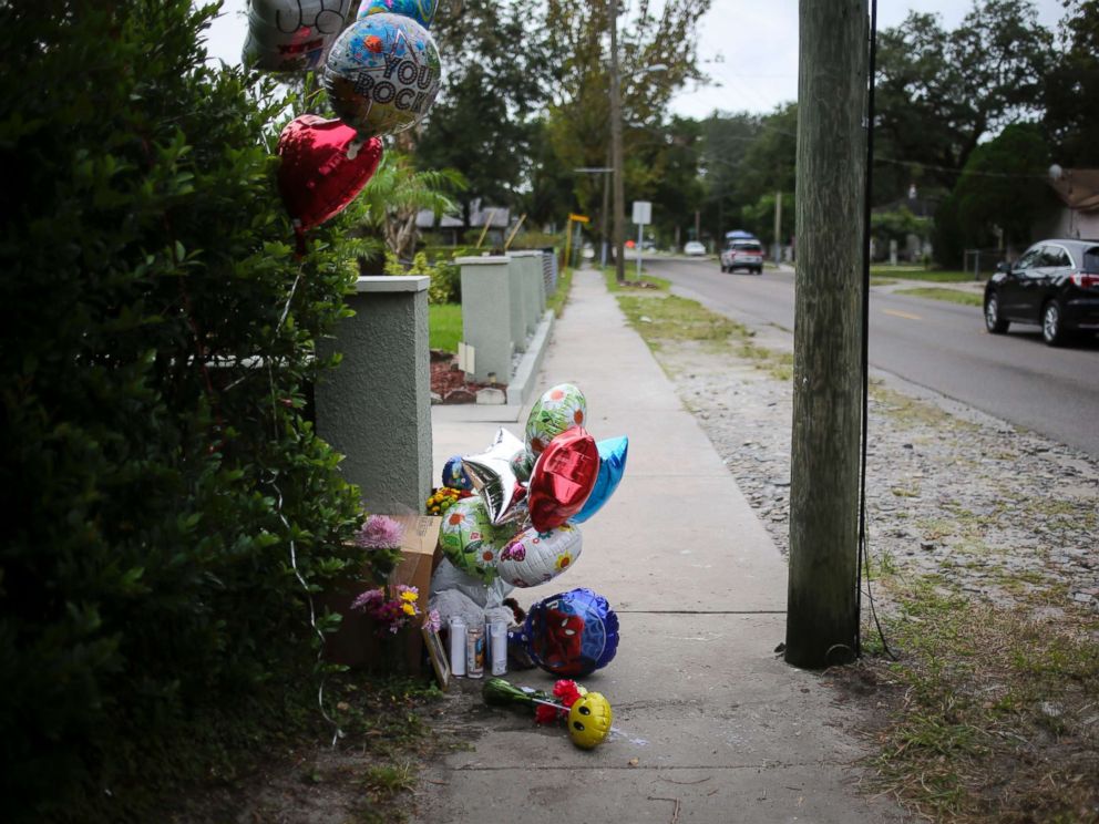 PHOTO: Balloons and candles seen along 15th Street on Oct. 23, 2017 where Anthony Naiboa, 20, was found dead on Oct. 19 in Southeast Seminole Heights in Tampa, Fla.