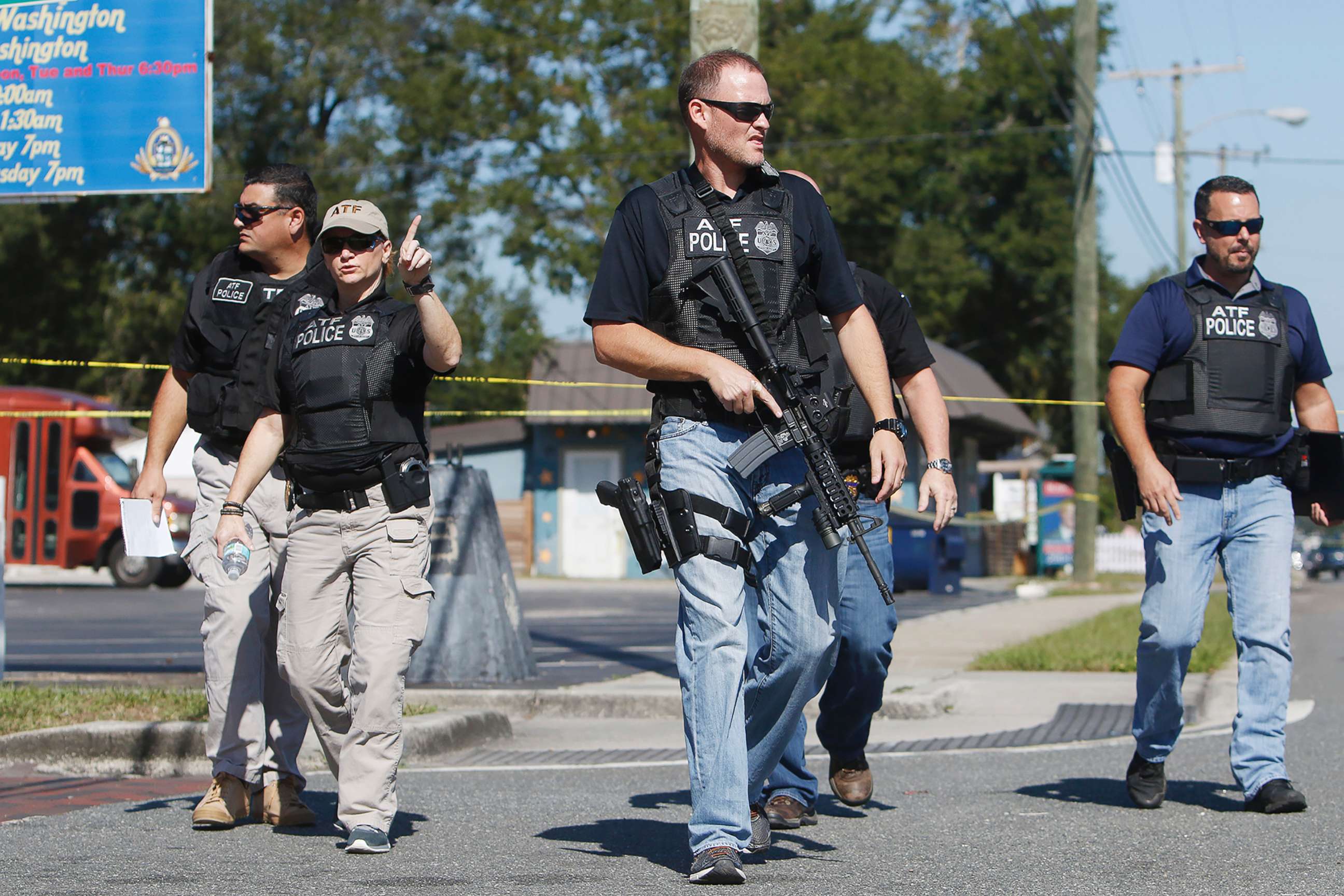 PHOTO: Members of the Tampa Police Department, Bureau of Alcohol, Tobacco, Firearms and Explosives and the Hillsborough County Sheriff's Office work the scene of a fatal shooting in the Seminole Heights neighborhood in Tampa, Fla., Nov. 14, 2017. 
