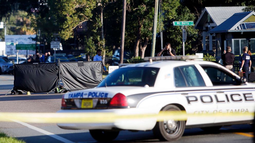 Law enforcement agents investigate a fatal shooting in the Seminole Heights neighborhood in Tampa, Fla., Nov. 14, 2017.  