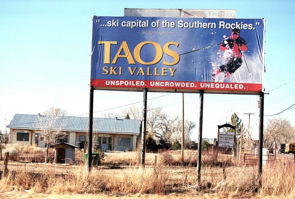   PHOTO: A billboard for Taos Ski Valley, New Mexico, above a bare ground, February 9, 2000. 