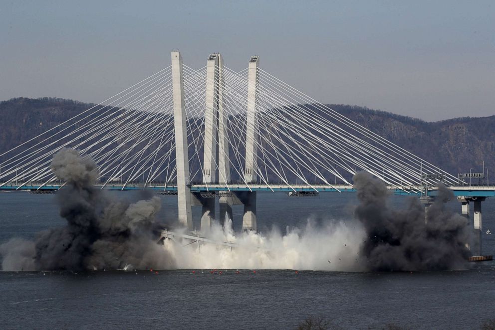 PHOTO: The east anchor span of the old Tappan Zee Bridge is demolished by explosives into the Hudson River in front of the new Mario Cuomo Bridge in Tarrytown, N.Y., Jan. 15, 2019.