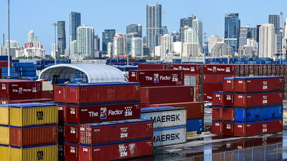 PHOTO: Shipping containers at the Port of Miami stand in front of the skyline of Miami, April 9, 2025. 