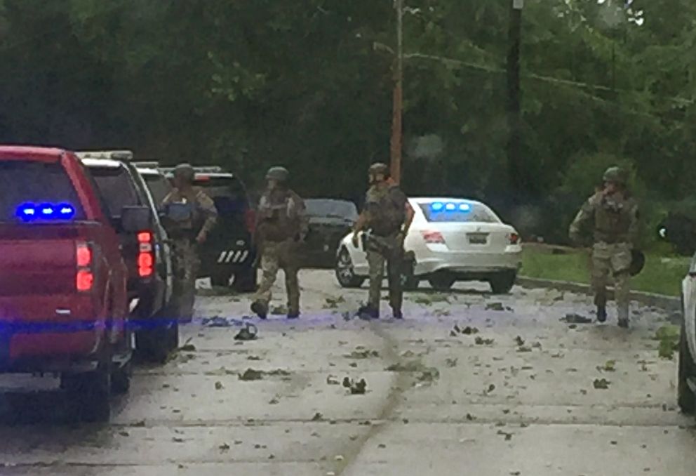 PHOTO: Officers from the Tarrant Police Department in Alabama investigate a home invasion on May 29, 2018.