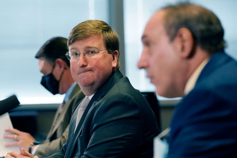 PHOTO: Gov. Tate Reeves, left, listens as State Epidemiologist Dr. Paul Byers, answers a reporter's question during his media update on the current situation of COVID-19 in Mississippi, Tuesday, Feb. 23, 2021, in Jackson, Miss.
