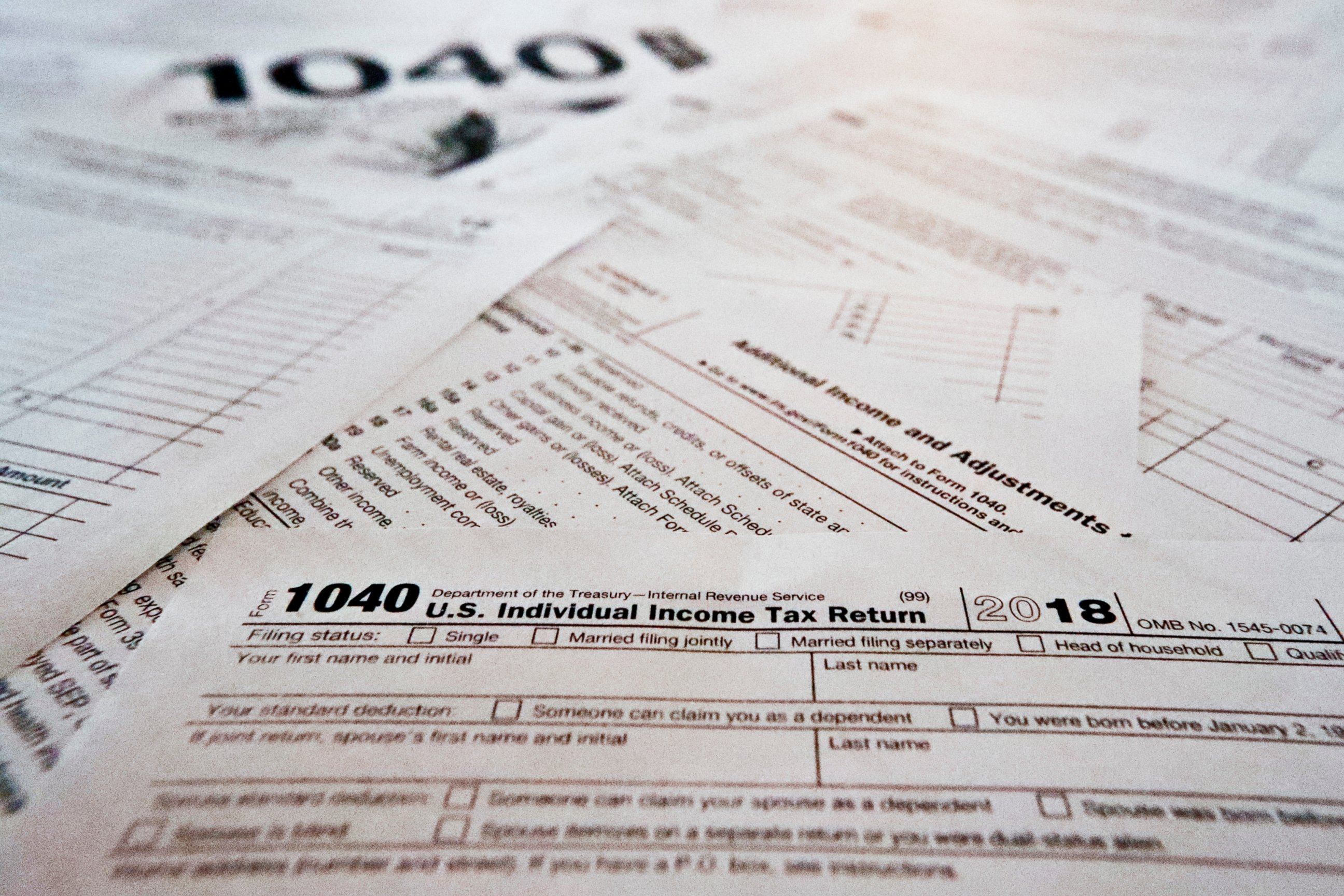 PHOTO: This photo shows multiple forms printed from the Internal Revenue Service web page that are used for 2018 U.S. federal tax returns.