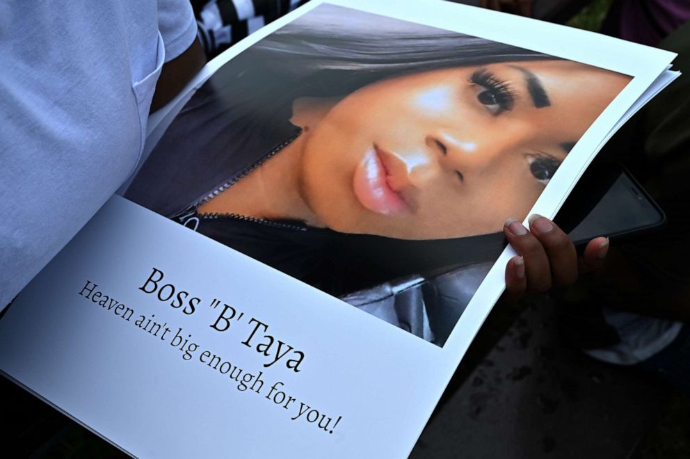 PHOTO: A mourner holds a photo of Taya Ashton at a gathering for the 20-year-old  transgender woman who was shot and killed at her apartment in Suitland, Md., July 21, 2021.