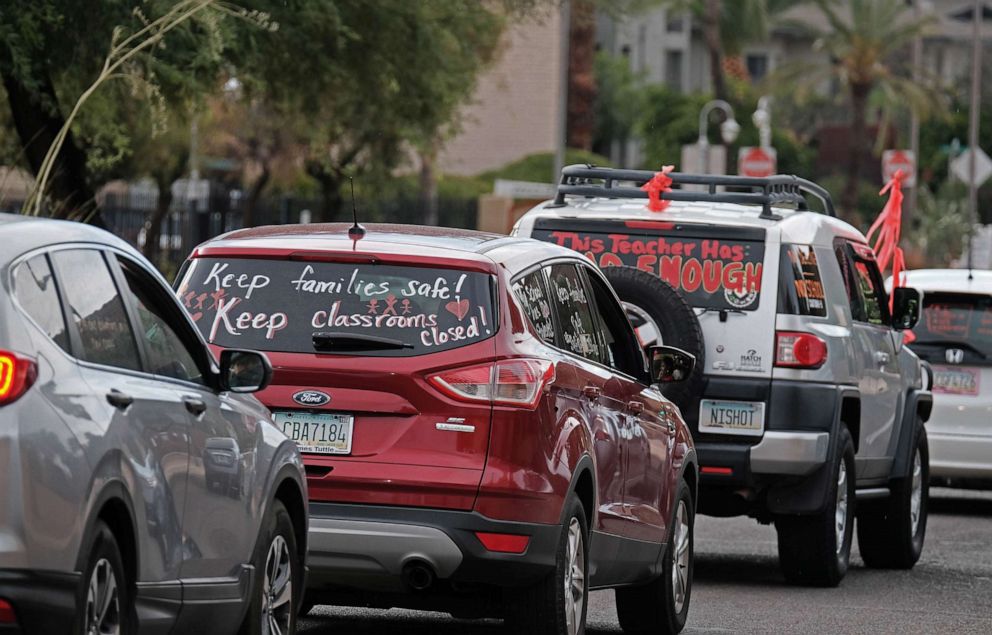 PHOTO: Educators, parents and community members take place in a Motor March demanding a safe opening of schools for in-person learning on July 16, 2020, in Tucson, Ariz.