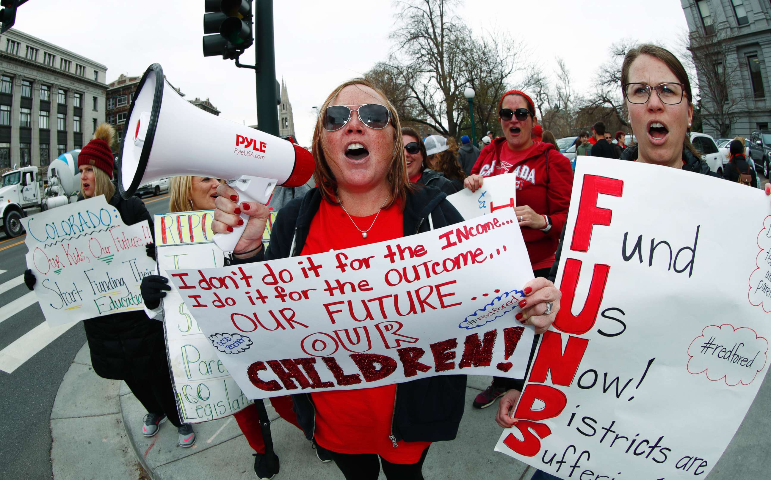 PHOTO: Nikee Onken, a teacher from Douglas County, Colo., uses a bullhorn to lead supporters during a teacher rally Thursday, April 26, 2018, in Denver.