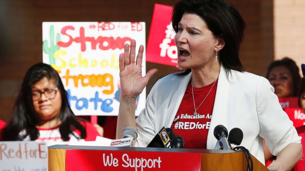 PHOTO: NEA President Lily Eskelsen Garcia speaks at the #RedForEd Walkout, March and Rally news conference regarding teacher pay and school funding Wednesday, April 25, 2018, in Phoenix.