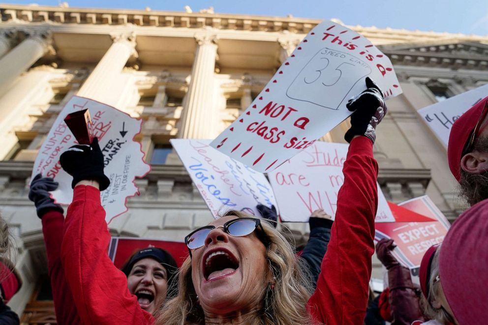 PHOTO: Candy Handy dances on the steps of the Capitol Building as teachers hold a one day walkout at the statehouse in Indianapolis, Nov. 19, 2019.