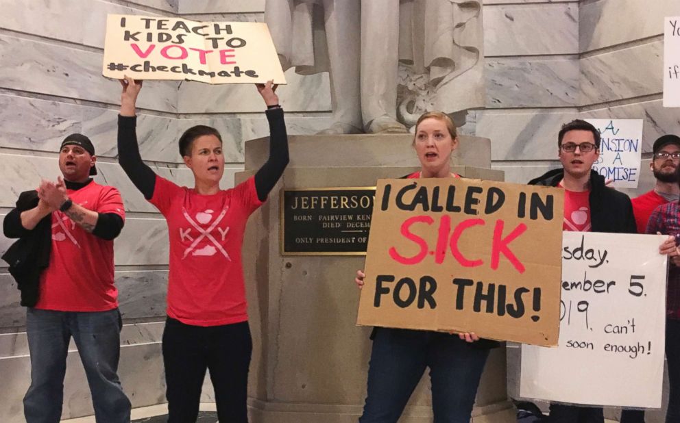 PHOTO: Whitney Walker, second left, and Tracy Kurzendoerfer protest outside of Kentucky Gov. Matt Bevin's office, March 30, 2018 in Frankfort, Ky.