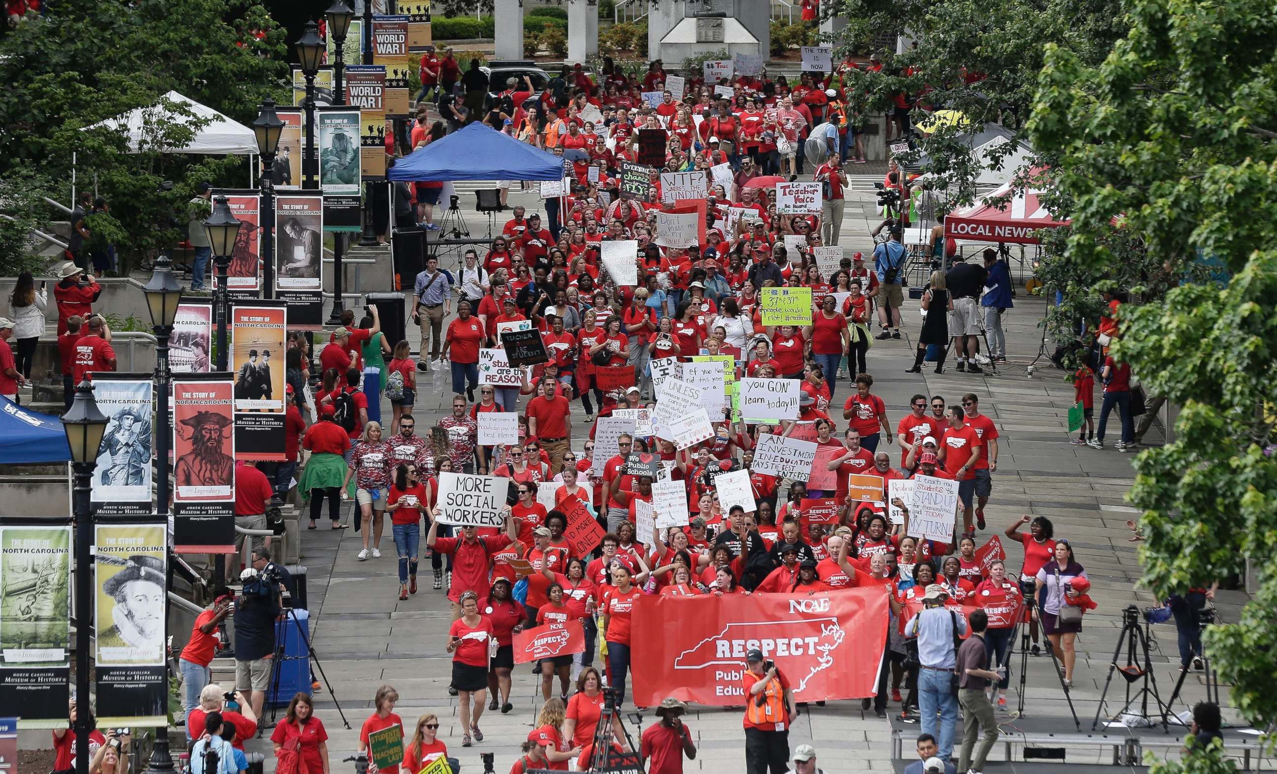 PHOTO: Participants make their way towards the Legislative Building during a teachers rally at the General Assembly in Raleigh, N.C., on May 16, 2018.