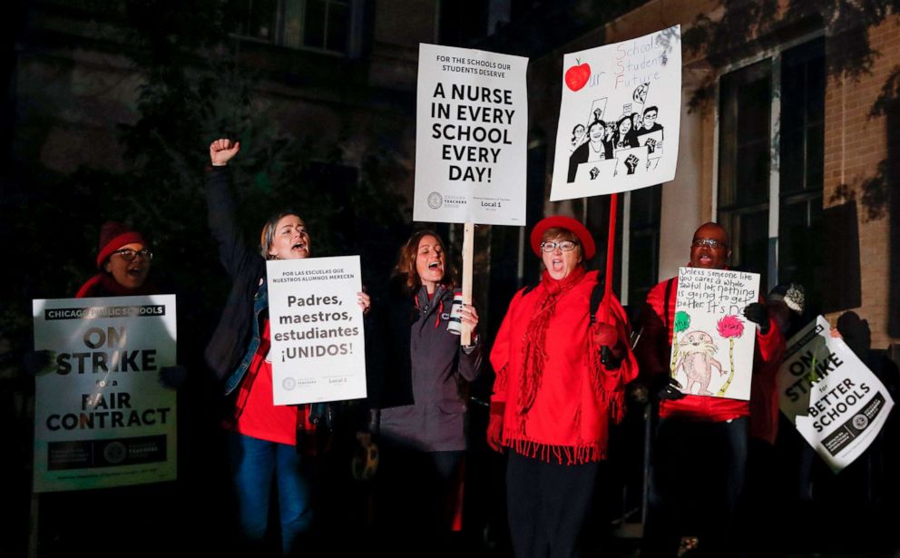 PHOTO: Striking teachers and supporters walk a picket line outside Peirce Elementary School on the first day of strike by the Chicago Teachers Union, Oct. 17 2019 in Chicago.