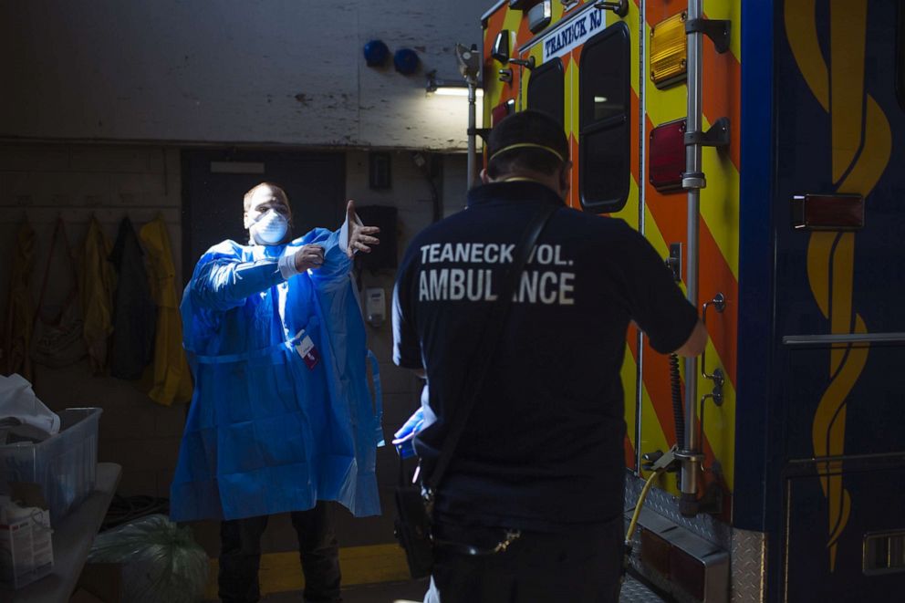 PHOTO: Emergency medical technicians before a call, at an ambulance station house in Teaneck, N.J., April 11, 2020.