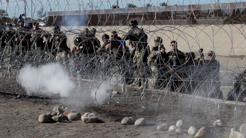 PHOTO: U.S. soldiers and U.S. border patrol officers fire tear gas towards migrants from the U.S.side of the border fence between Mexico and the United States in Tijuana, Mexico, Nov. 25, 2018.