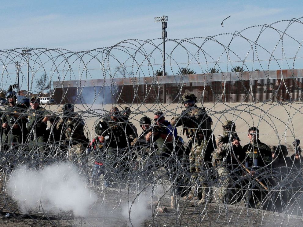 PHOTO: U.S. soldiers and U.S. border patrol officers fire tear gas towards migrants from the U.S.side of the border fence between Mexico and the United States in Tijuana, Mexico, Nov. 25, 2018.