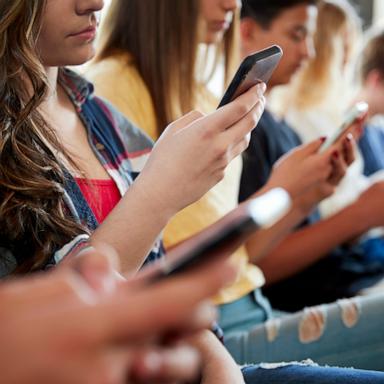 PHOTO: Teenagers on phones in undated stock photo. 