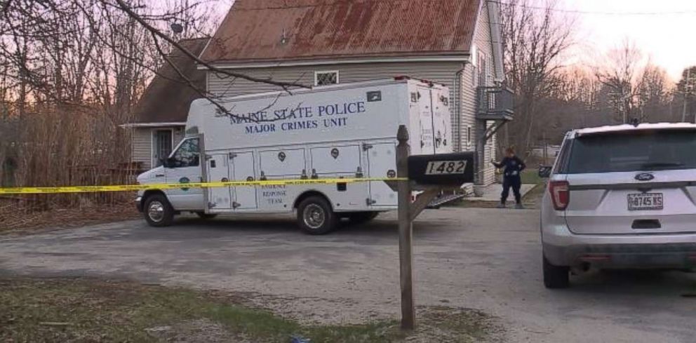 Police investigate a home in Litchfield, Maine, where a woman was found strangled and stabbed.