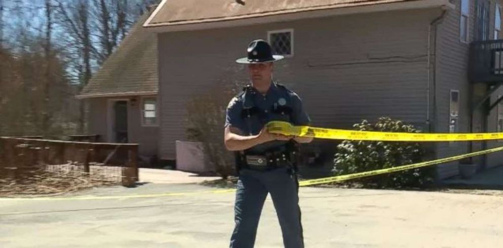 Police investigate a home in Litchfield, Maine, where a woman was found strangled and stabbed.