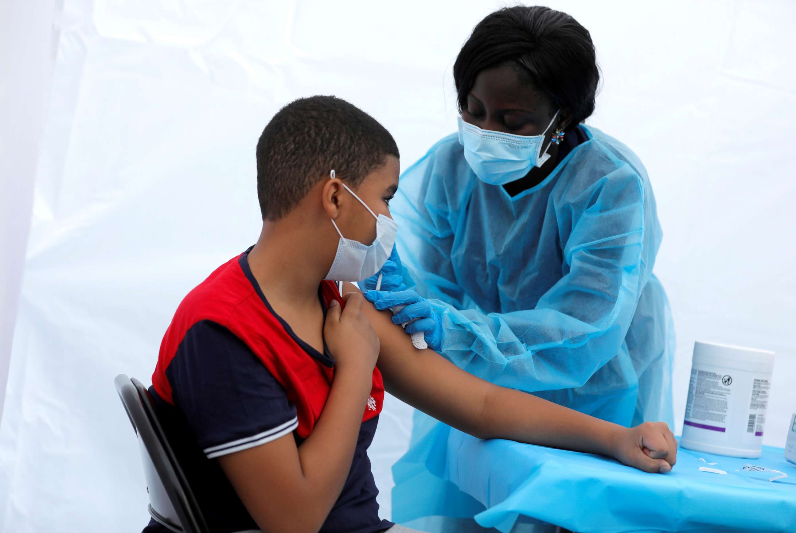 PHOTO: A 12-year-old receives a dose of the Pfizer-BioNTech vaccine for COVID-19 during a vaccination event in New York, June 4, 2021.