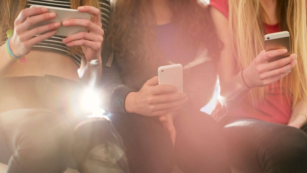 PHOTO: A group of teenage girls are pictured texting on their phones in this undated stock photo. 
