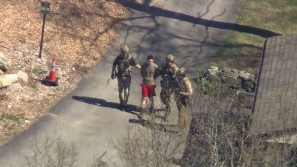 PHOTO: Suspected classified document leaker and U.S National Guardsman, Jack Teixeira, is taken into custody by FBI agents in North Dighton, Mass., April 13, 2023.