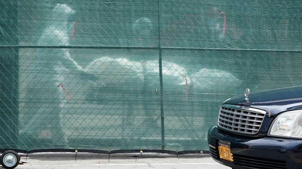 PHOTO: A body is removed from a refrigeration truck serving as a temporary morgue at the Brooklyn Hospital Center in the New York City borough of Brooklyn on April 8, 2020.