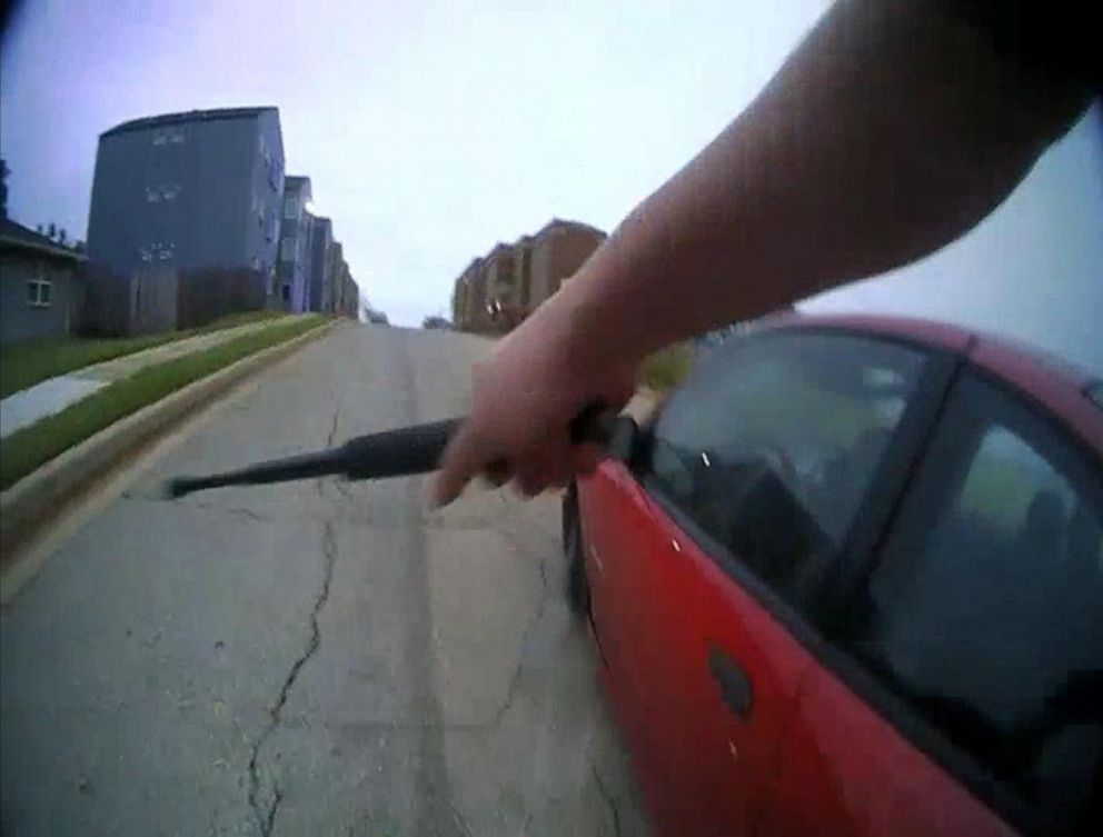 PHOTO: An image made from bodycam video shows police officers apprehending a ten-year-old boy driving a stolen car belonging to his aunt after he led them on a chase in Oklahoma City, April 23, 2019.