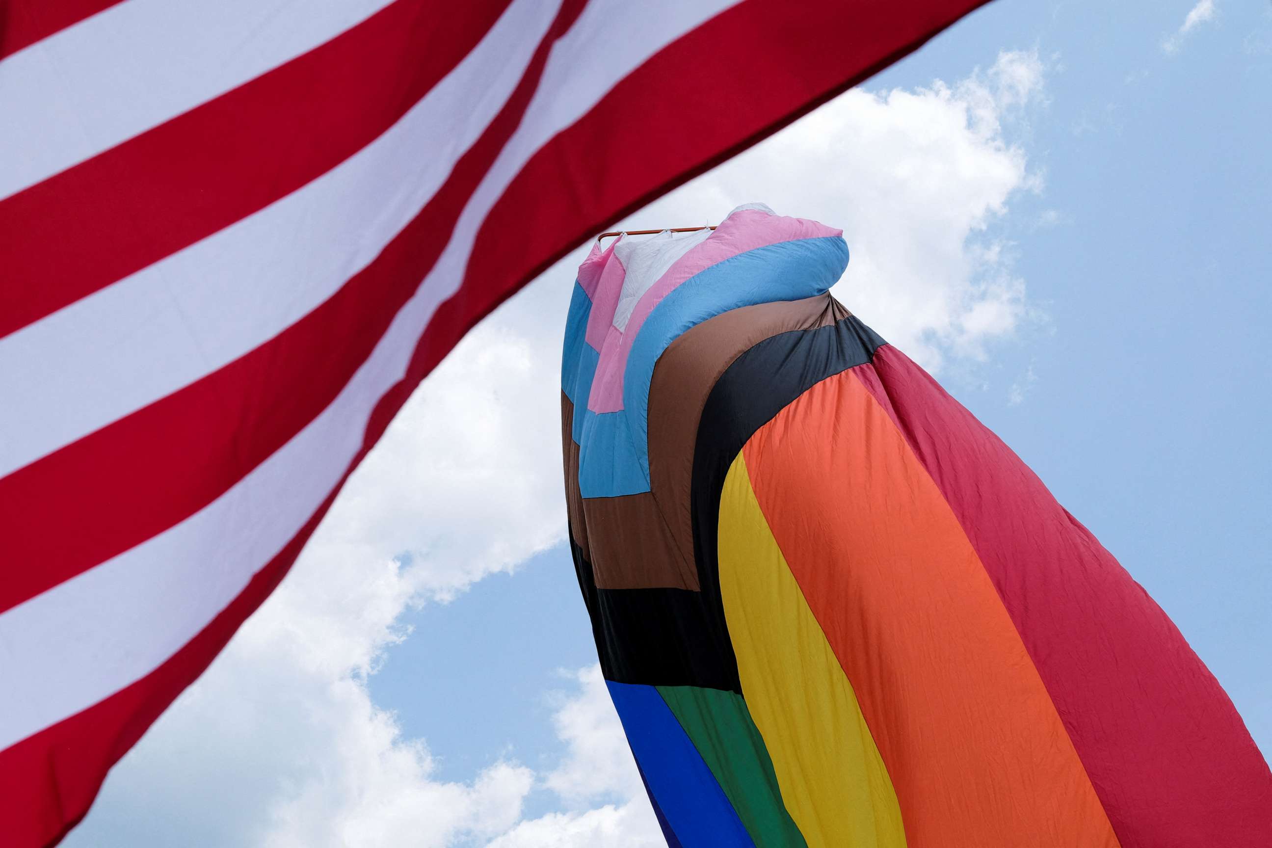 PHOTO: The U.S. and Rainbow flag blows in the wind during an all ages LGBTQ Pride event in Franklin, Tennessee, June 3, 2023.